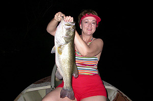 Steve Drexler's wife with a big bass caught at night