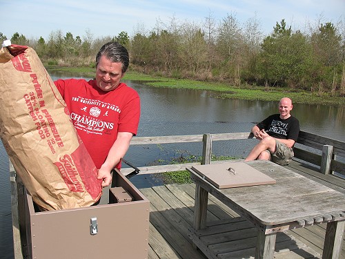 Jerry filling the fish feeder